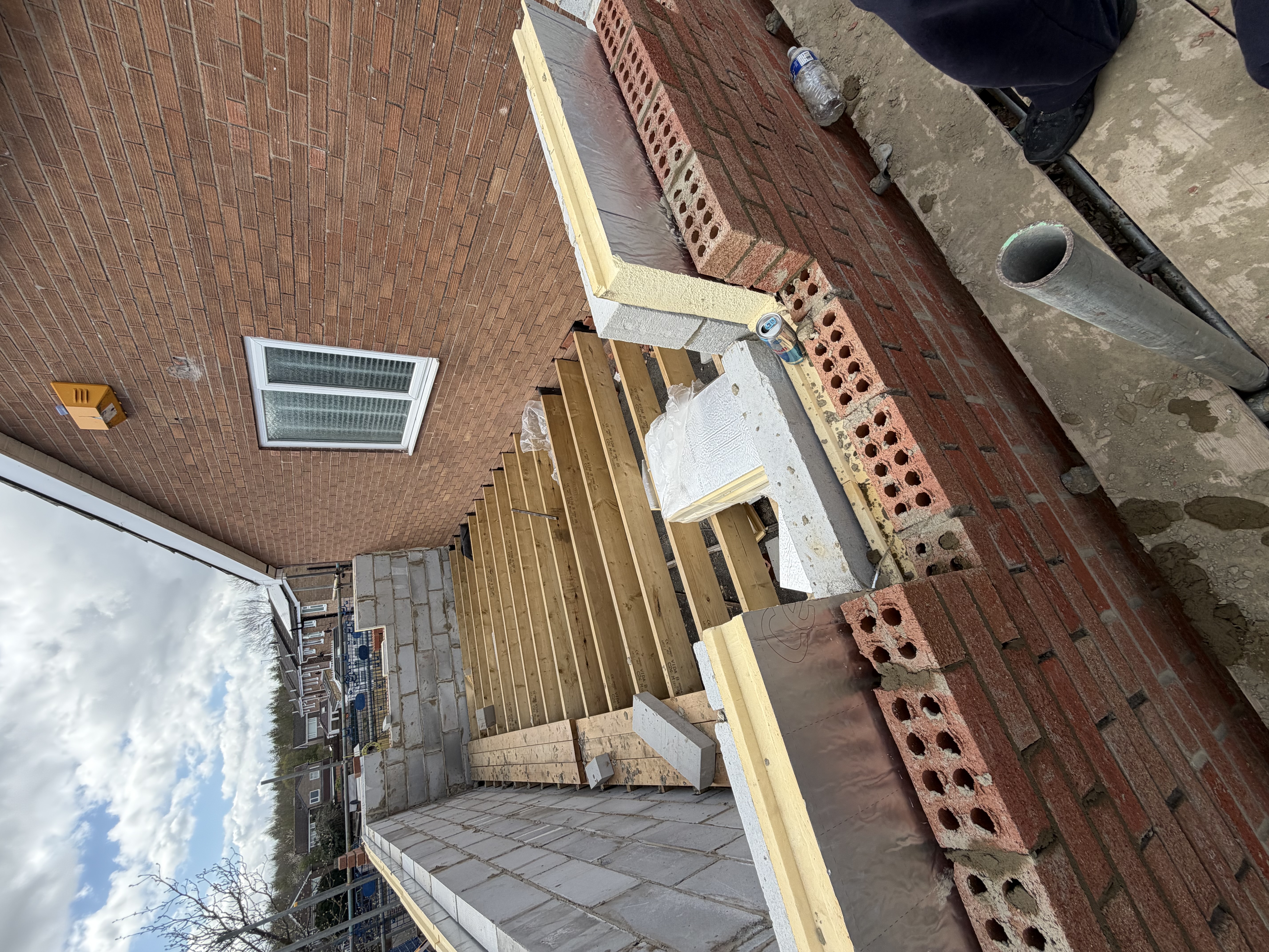 Double-storey extension project photo showing construction work in progress